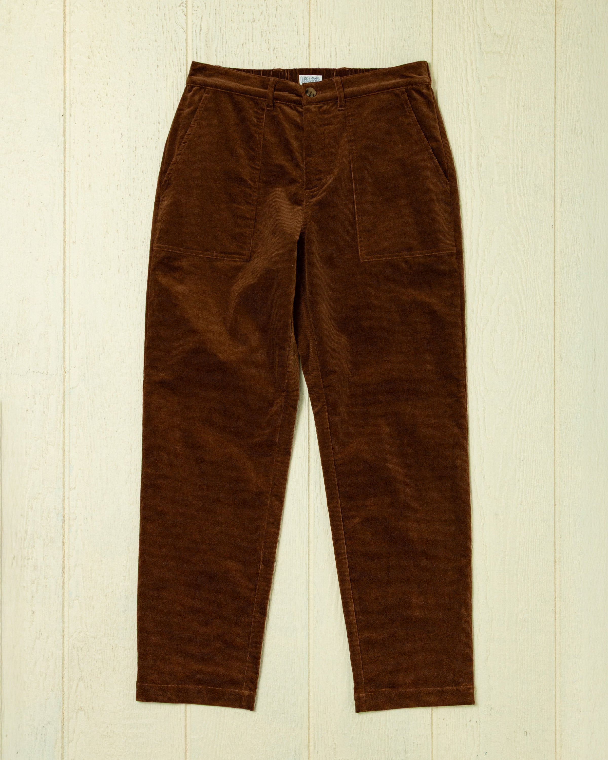 Broek van ribfluweel in roodbruin